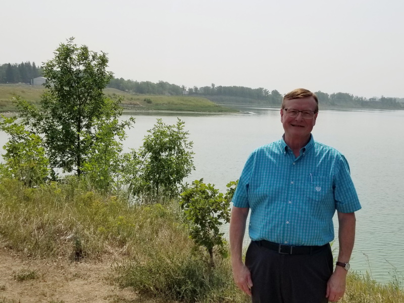 Greg Archibald stands on the shore