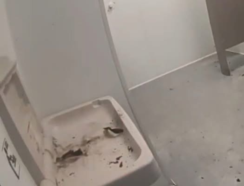 men's bathroom after fire
