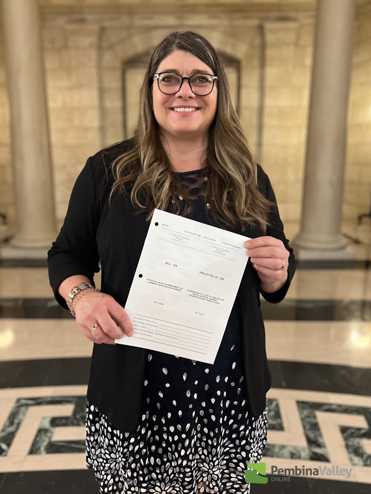 (Submitted photo) MLA for Morden-Winkler Carrie Hiebert with a copy of her first Bill 228