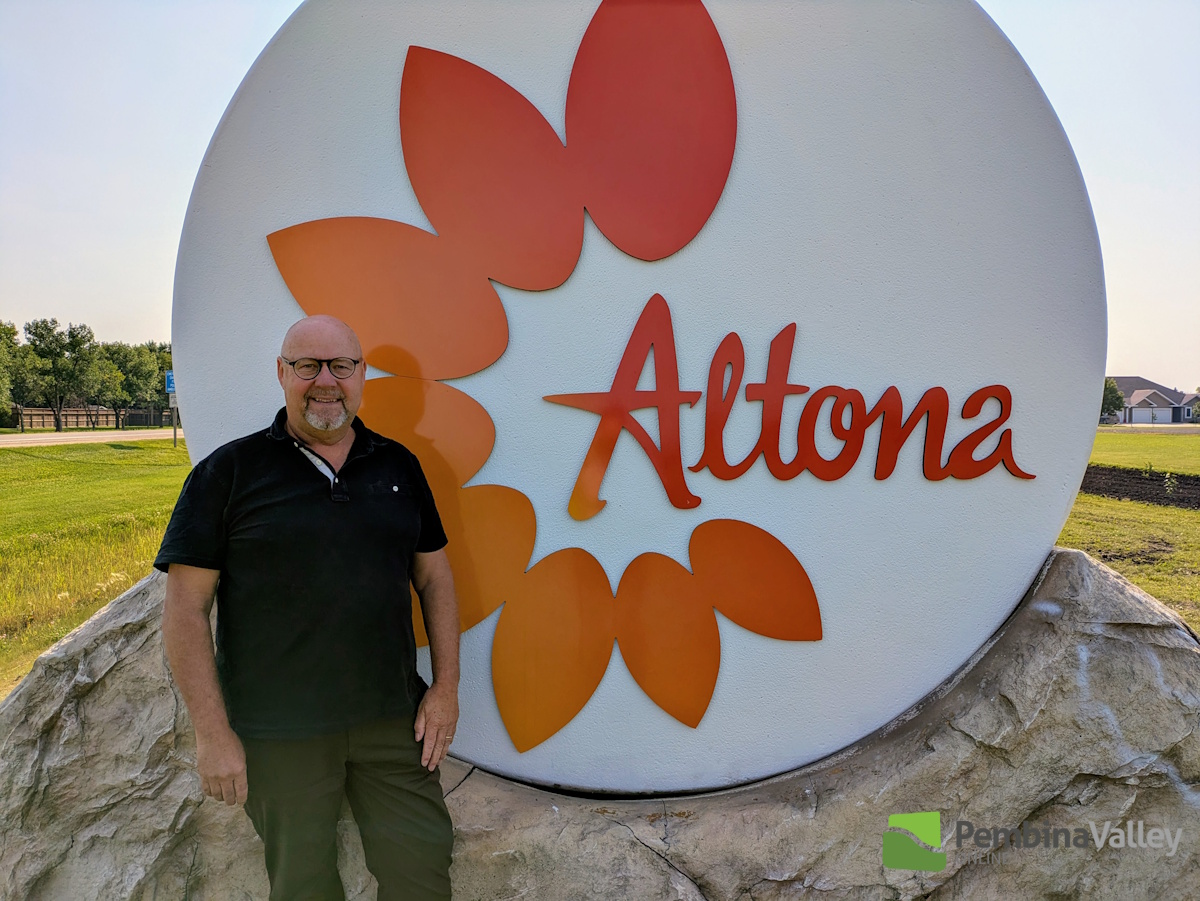 The Mayor with the west facing side of the sign