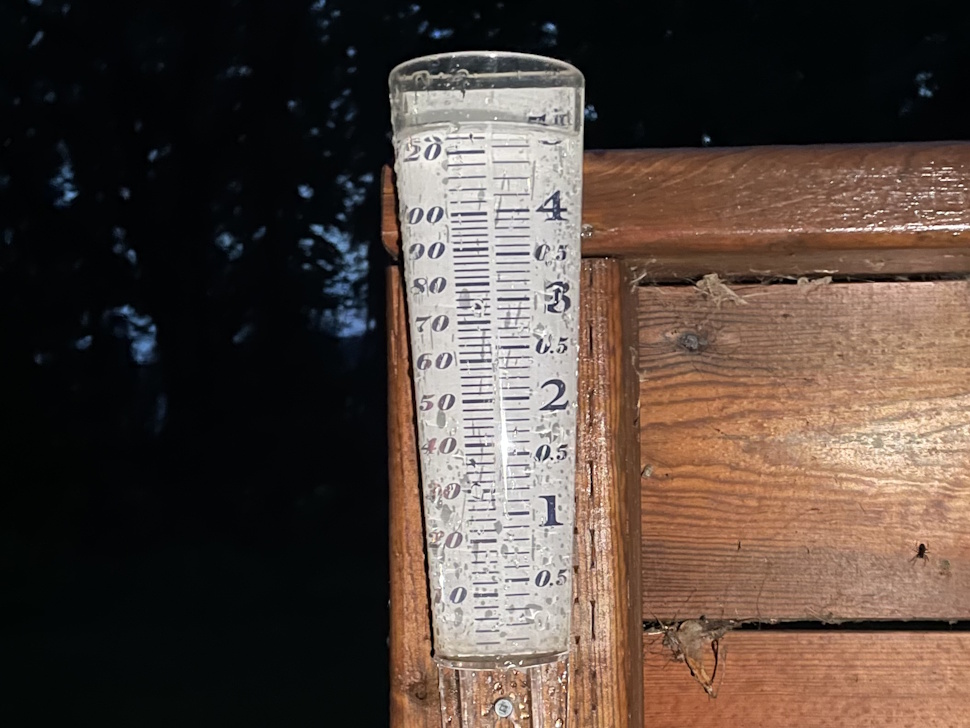 Close-up of a rain gauge in the Oakville area showing over 4 inches of rainfall after overnight storms.