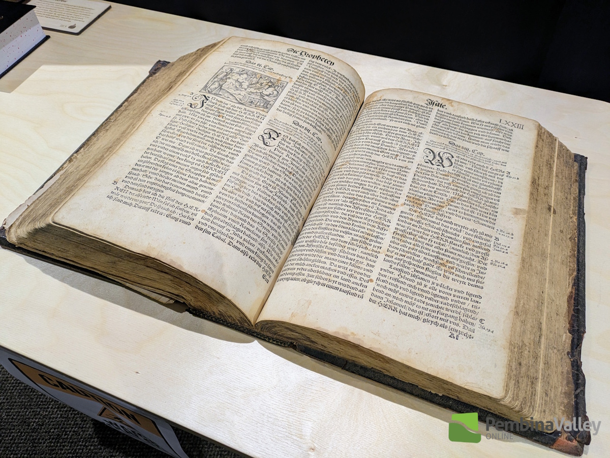 an archival Bible resting on a table
