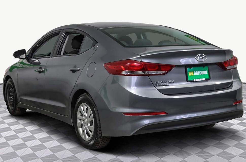 Rear view of a silver 2018 Hyundai Elantra parked on a road, similar to the vehicle reported stolen in Portage la Prairie, with Winnipeg Jets licence plate H19313.
