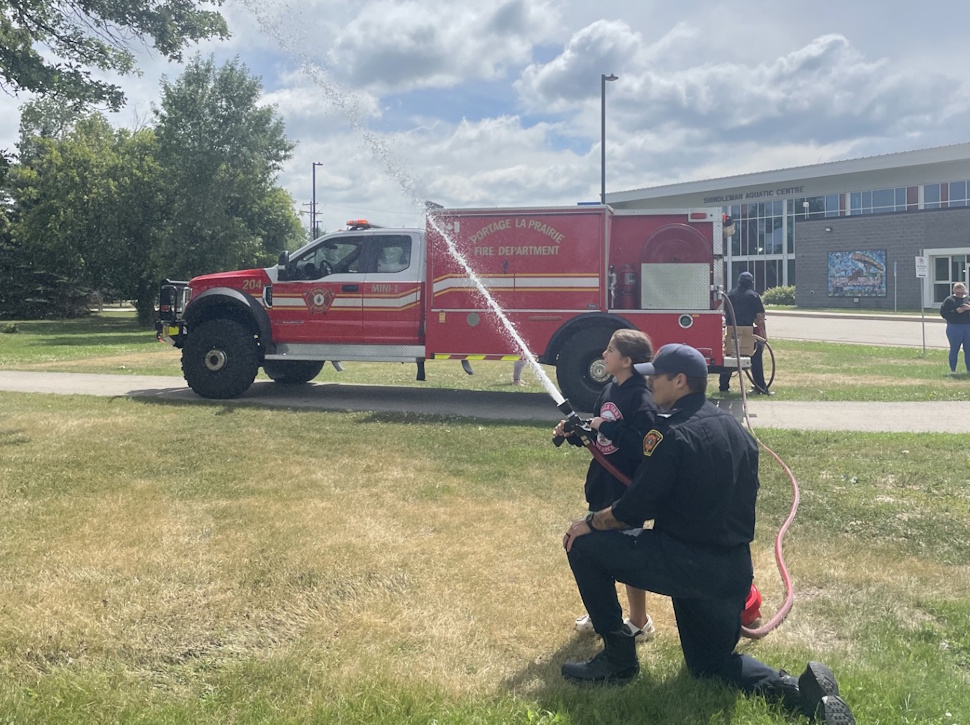 The fire department stopped by during 'Water Week' to teach the kids about fire safety and to stop, drop and roll. Submitted Photo/Maegan Inman