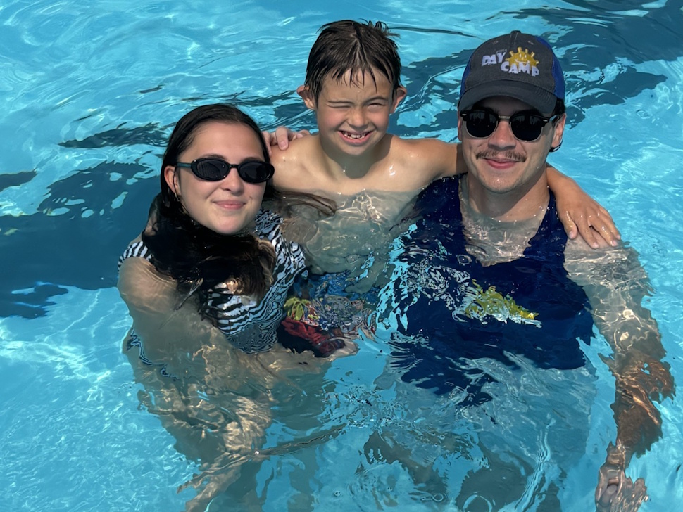 Day Camp staff Chloe Bryson and Evan Calder with Caleb (center) enjoying a swim at Splash Island. Submitted Photo/Maegan Inman