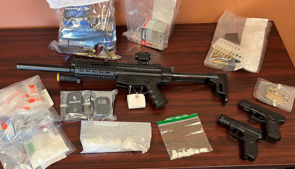 RCMP seized a loaded rifle with an extended magazine, brass knuckles, cocaine, and replica air guns designed to look like handguns from a Fairford home on August 22. Submitted Photo/RCMP