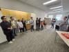 The group stands outside the Mayor's office, hearing more about the history of the building