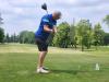 A golfer follows through on a strong drive under hot, humid skies during Stride’s fundraising tournament at Portage Golf Club. PortageOnline/ Tristen Sokolosky
