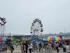 Crowds gather under cloudy skies for a fun-filled afternoon at the Morris Stampede Midway, where colourful rides, carnival games, and family memories take center stage. PortageOnline/ Tristen Sokolosky