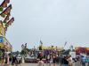 Crowds gather under cloudy skies for a fun-filled afternoon at the Morris Stampede Midway, where colourful rides, carnival games, and family memories take center stage. PortageOnline/ Tristen Sokolosky