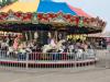 Crowds gather under cloudy skies for a fun-filled afternoon at the Morris Stampede Midway, where colourful rides, carnival games, and family memories take center stage. PortageOnline/ Tristen Sokolosky