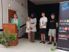 people stand beside a podium 
