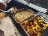 Smoker acution food being cooked and ready to serve.