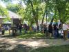 People gathered in the shade for magic, music and animals during the day.