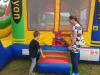 Kids enjoying Sundays activities, like the bouncy castle avaliable.