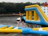 a person goes across an inflatable obstacle course