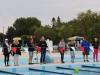 people lined up at the side of the pool